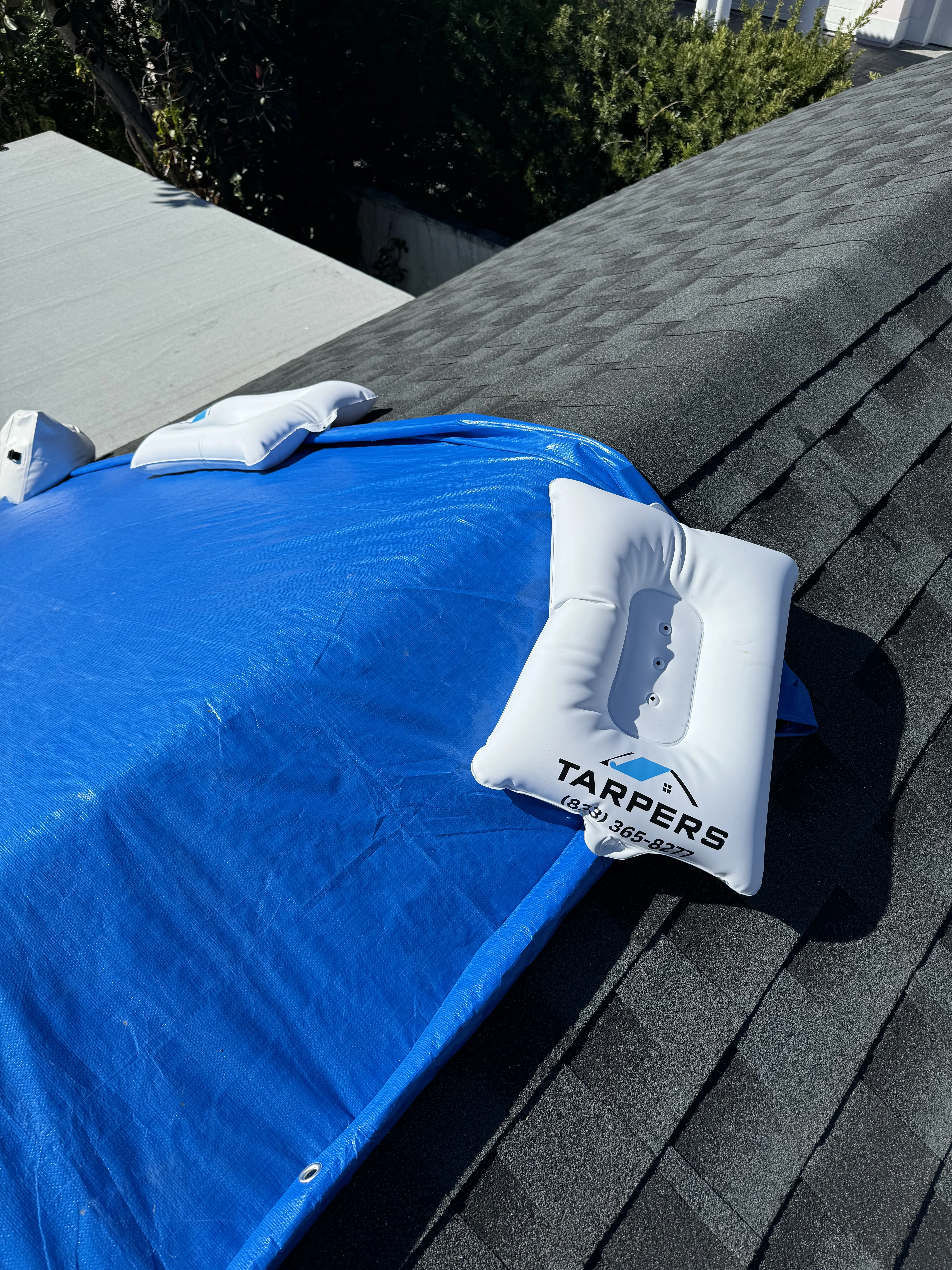 Time lapse style photo of storm damaged roof showing progressive water damage if untarped