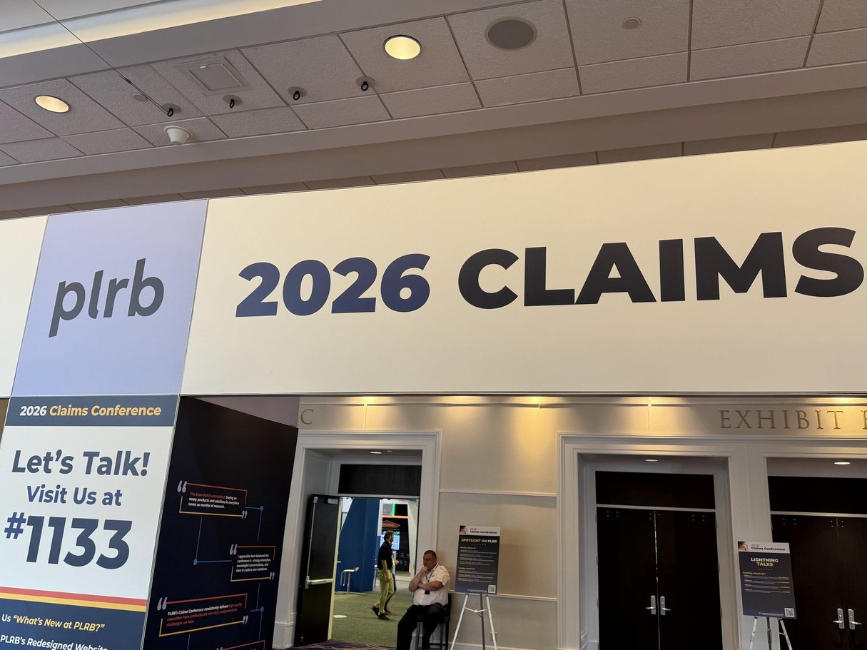 PLRB 2026 Claims Conference entrance at the exhibit hall showing the conference signage and booth information