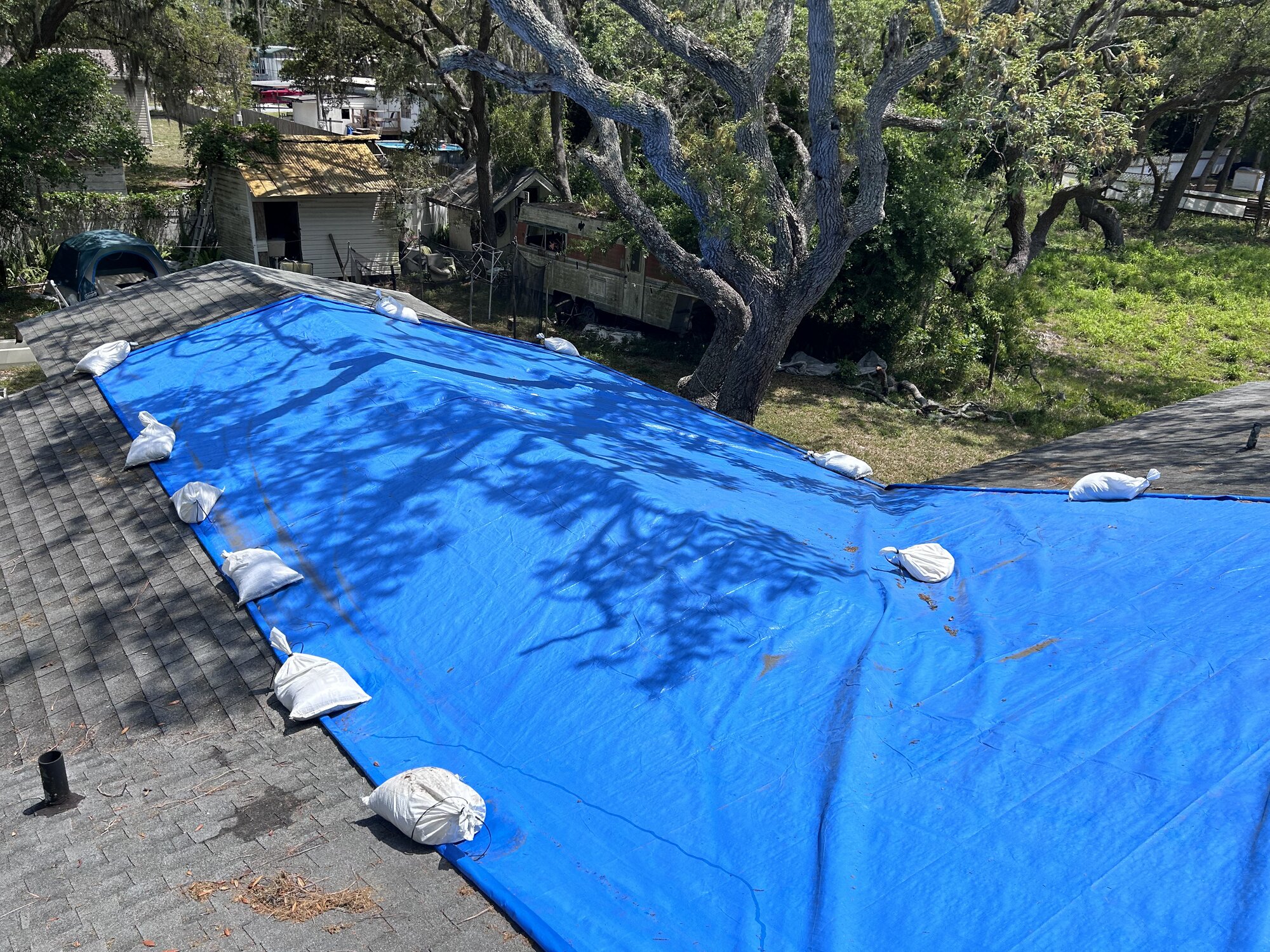 Hurricane damage mitigation - Xactware compliant installation photos