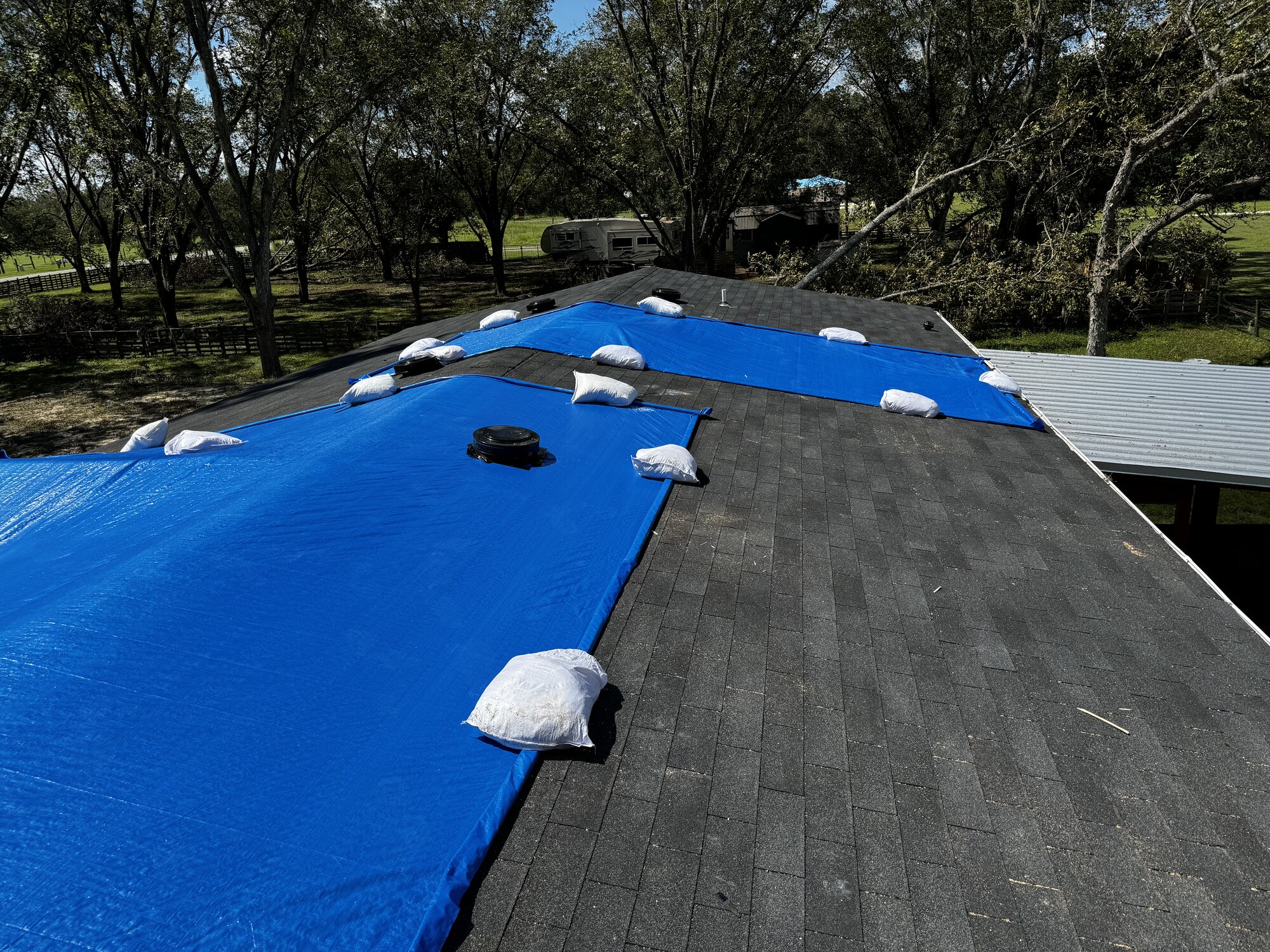 Hurricane roof damage mitigation - verified tarping for property adjusters