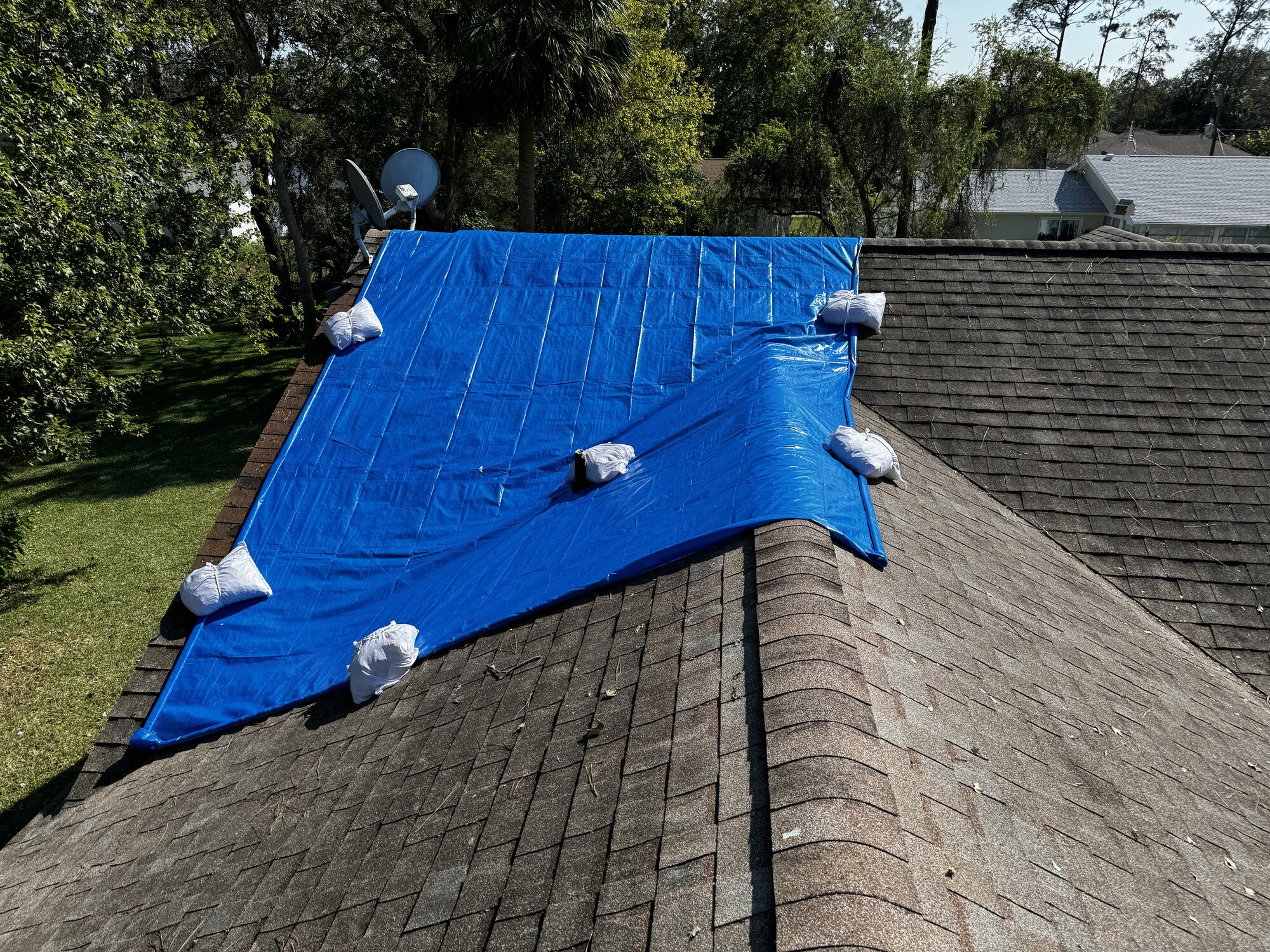 Storm mitigation tarping - property insurance claims photography